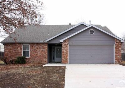 gray house with brick facade